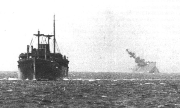 Empire Hope HMS Eagle going down on the right